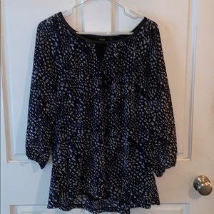 Sheer blue and black print blouse.